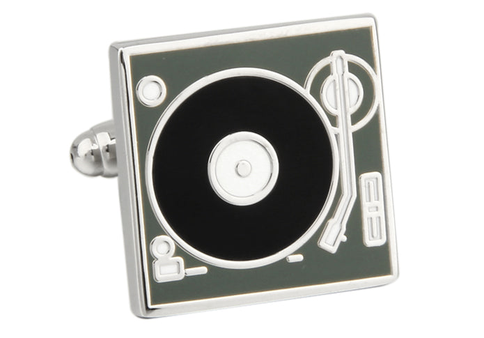 Turntable cufflinks with a black disc and silver accents on a white background