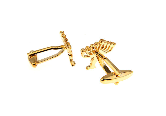Gold Menorah cufflinks on a white background