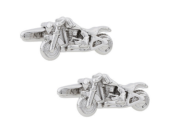 Motorcycle-shaped cufflinks on a white background