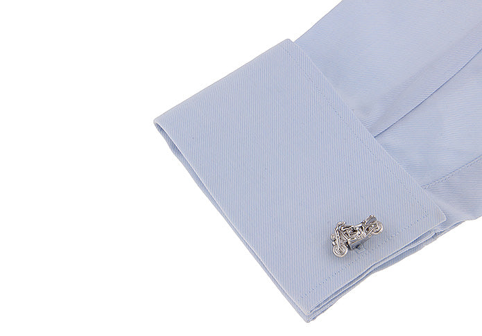 Cufflink on a light blue shirt cuff