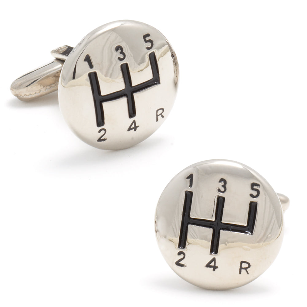 Silver gear shift cufflinks with black numbers on a white background