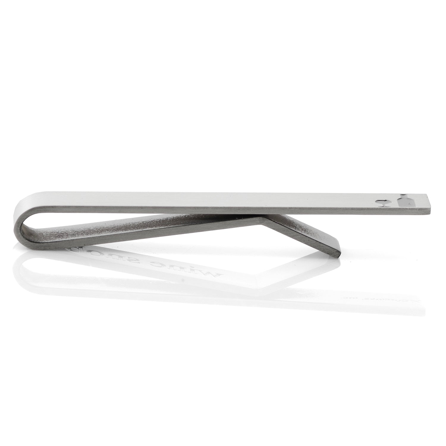 Metallic tie clip on a white background