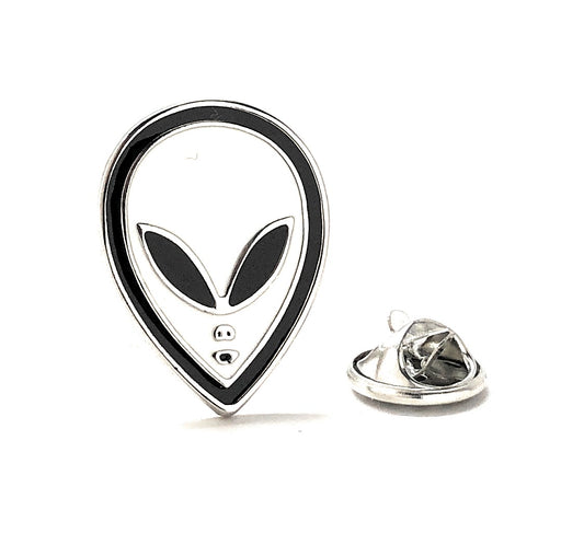 Alien head-shaped pin with a clear back on a white background
