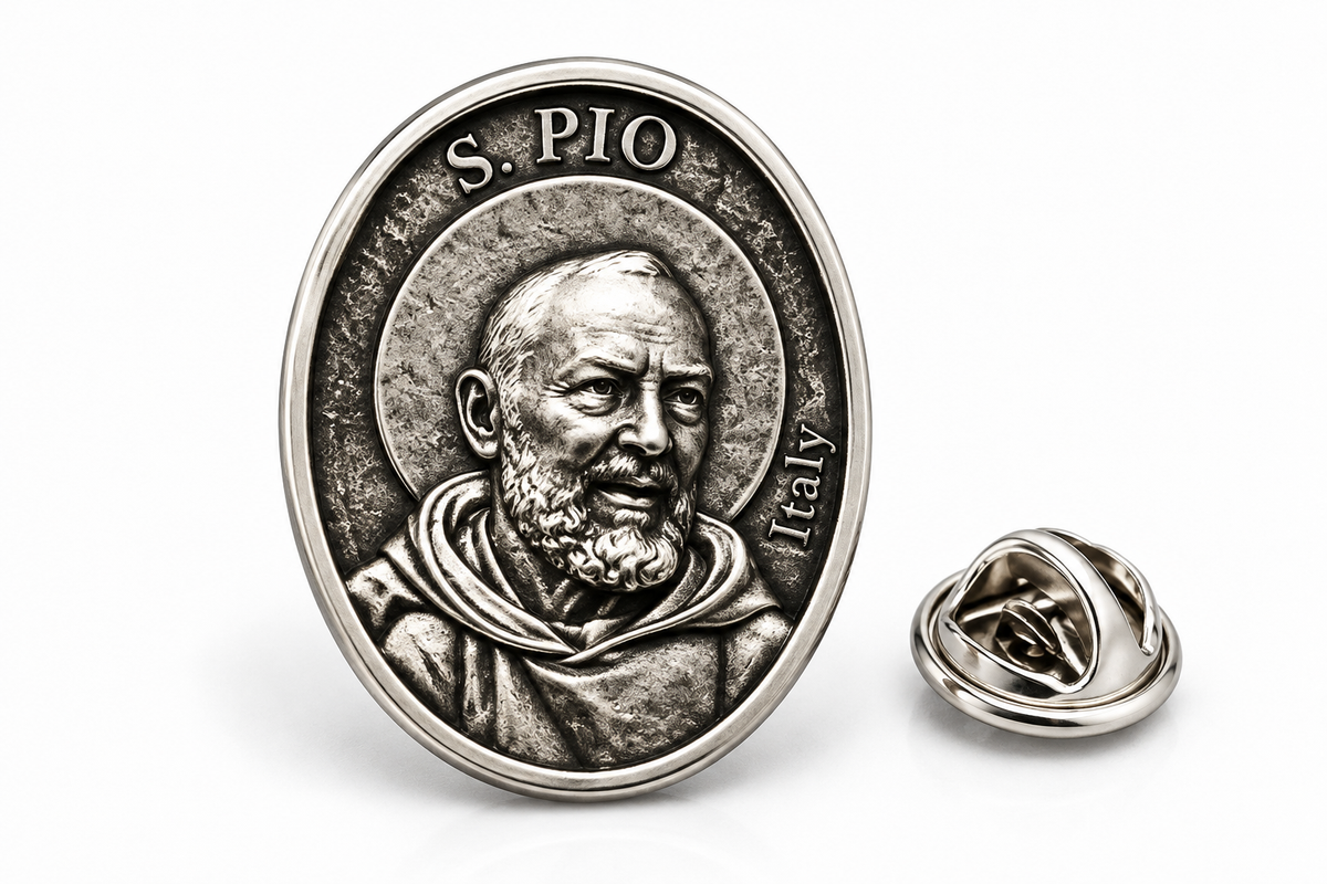 An oval silver-tone lapel pin featuring a relief portrait of Saint Pio of Pietrelcina with the text 'S. PIO' and 'Italy' on a clean white background, shown alongside the pin's folded clasp view.