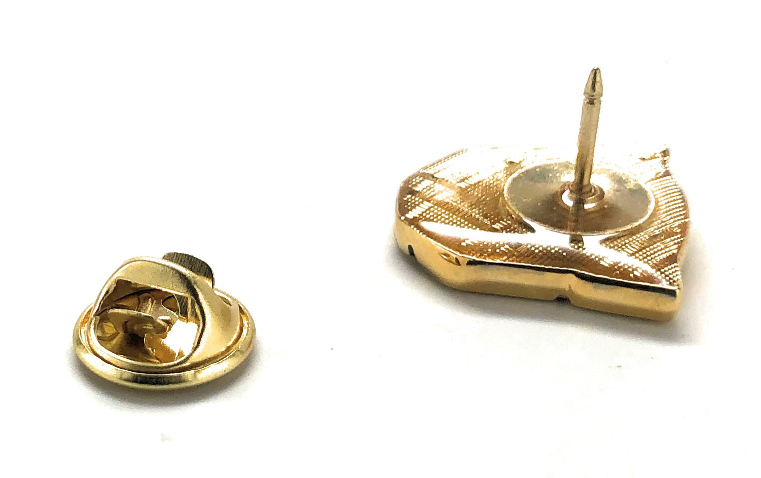 Gold Transformers robot emblem lapel pin with black detailing and gold clutch backing.