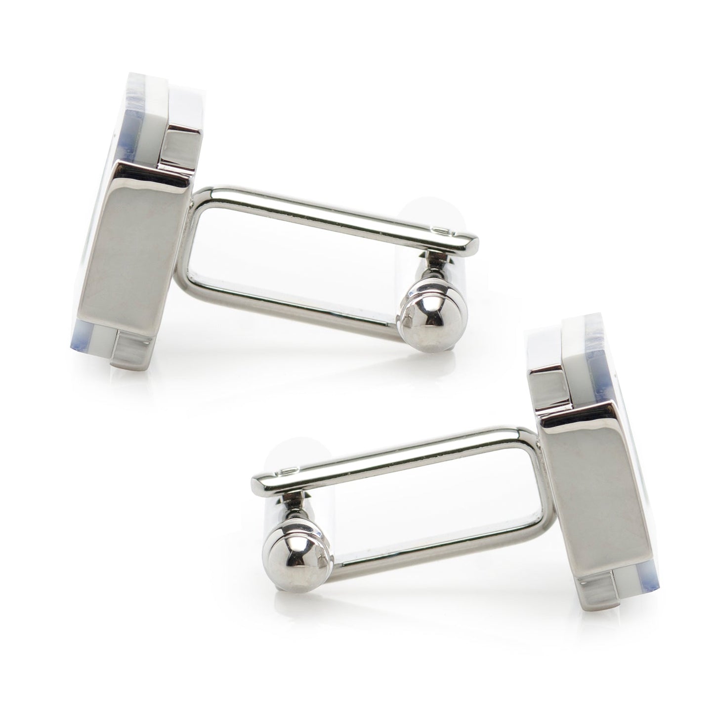 Silver cufflinks with a white background