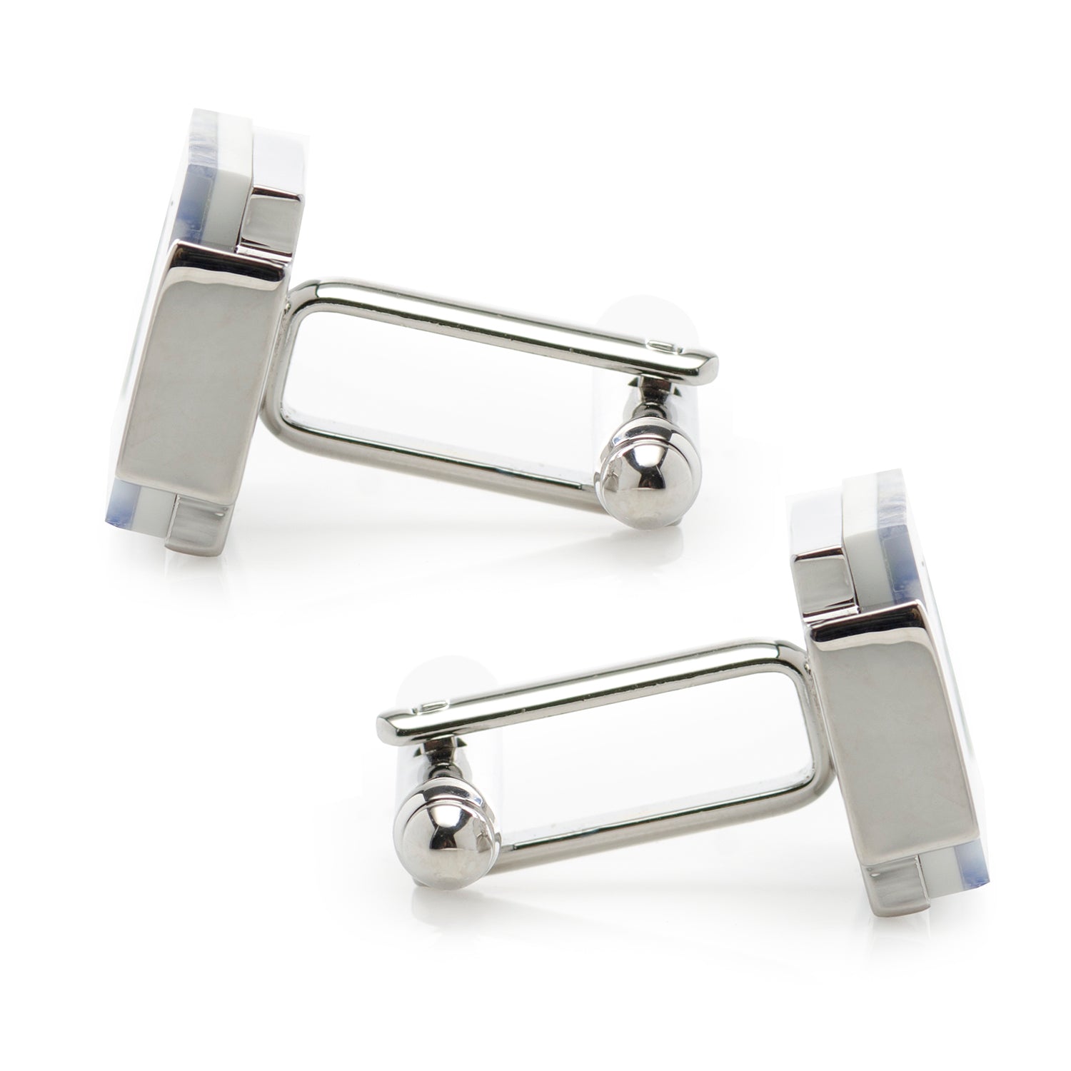 Silver cufflinks with a white background