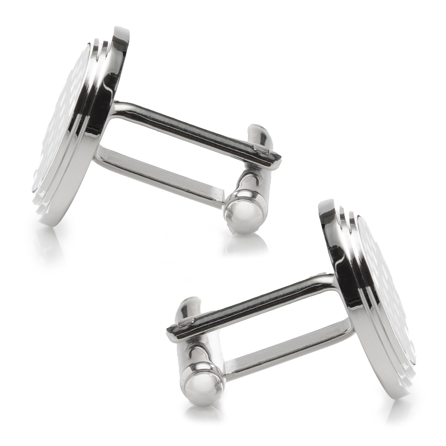 Silver cufflinks on a white background