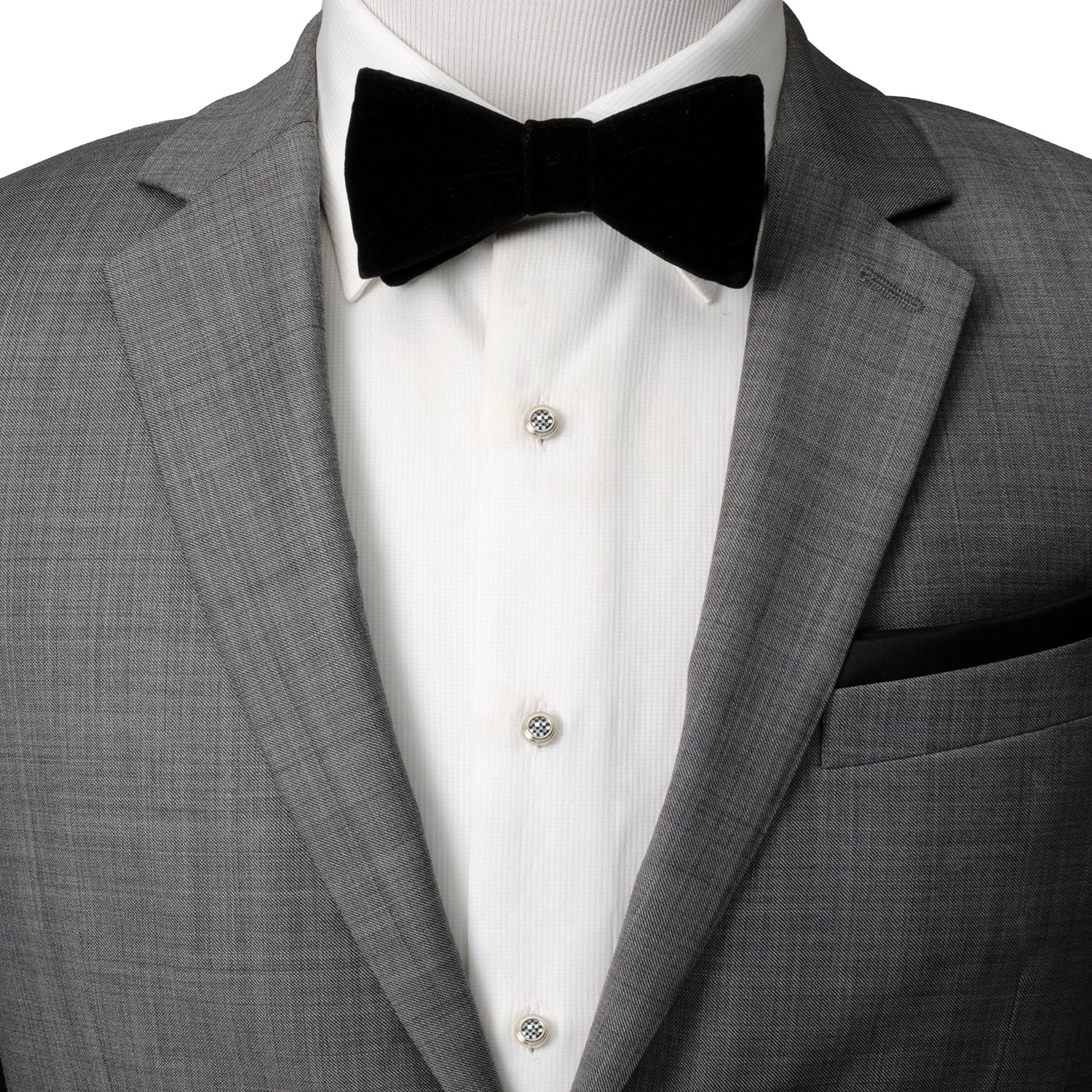 Gray tuxedo with a black bow tie and white dress shirt on a mannequin.