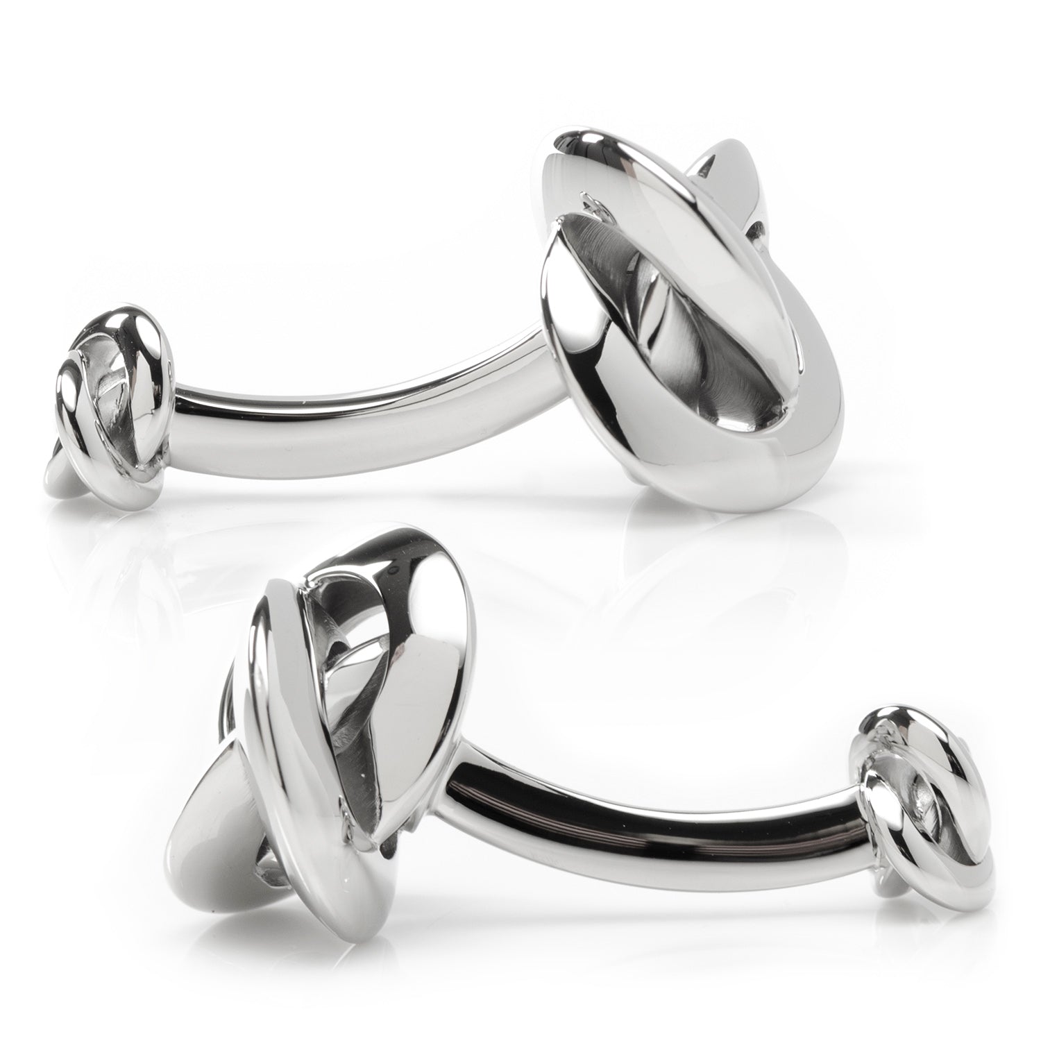 Two silver tongue rings on a white background