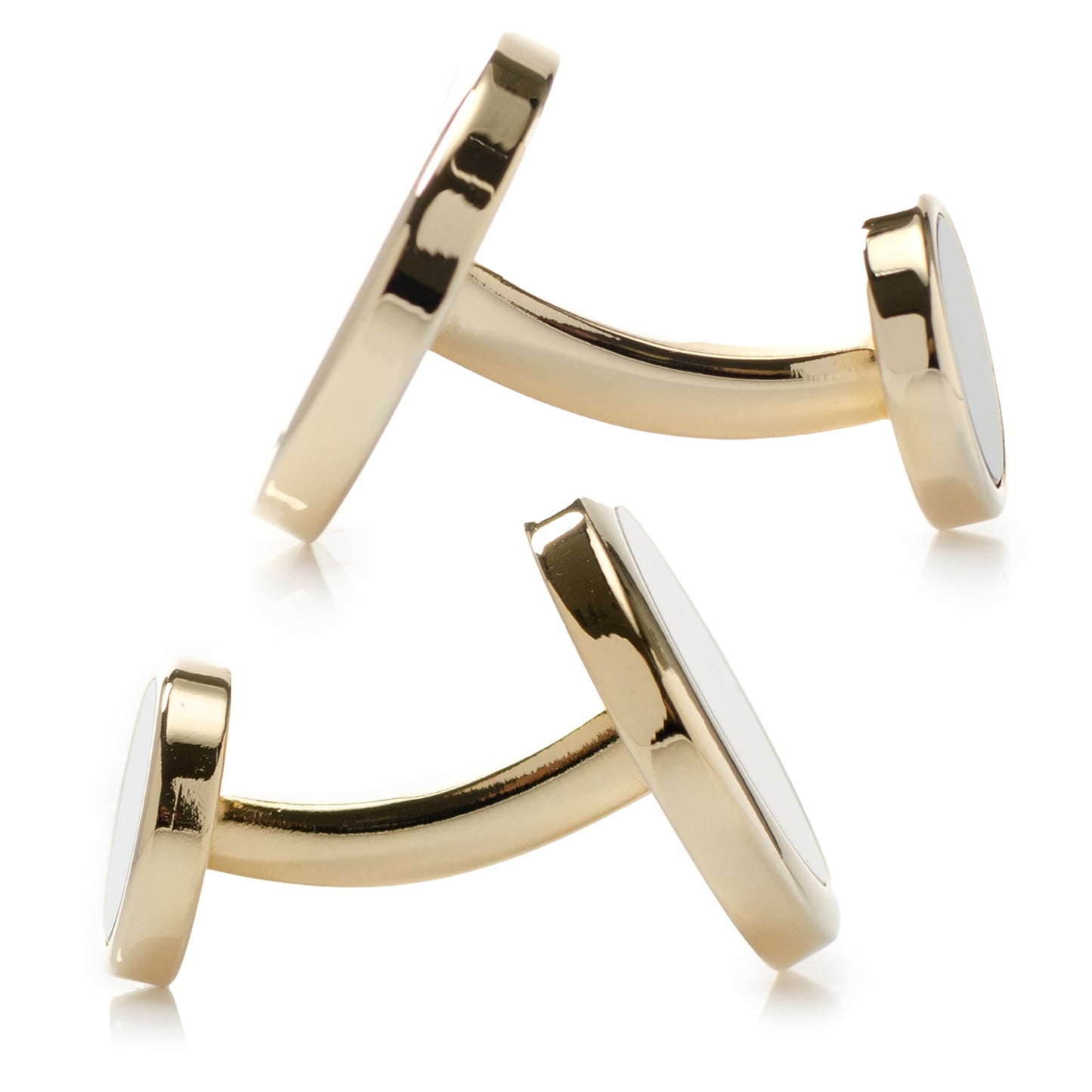 Gold cufflinks on a white background