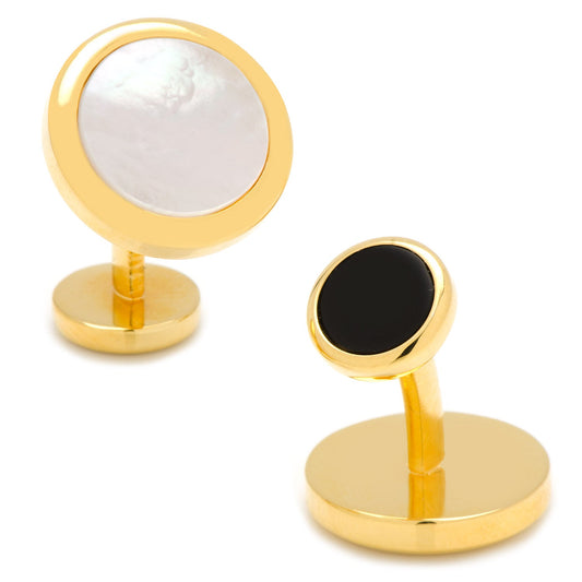 Gold cufflinks with one black and one white gemstone on a white background