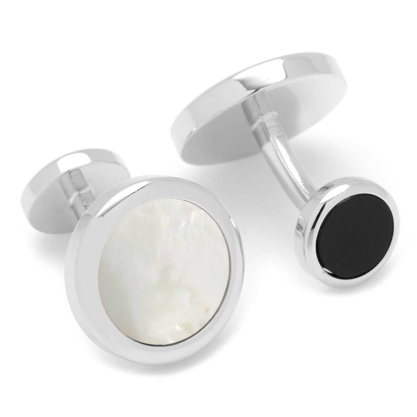 Silver cufflinks with white and black stones on a white background