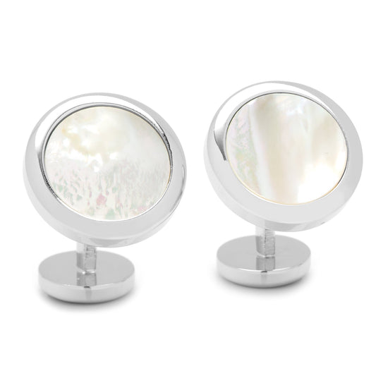 Pair of silver cufflinks with a round design featuring a white stone on a white background