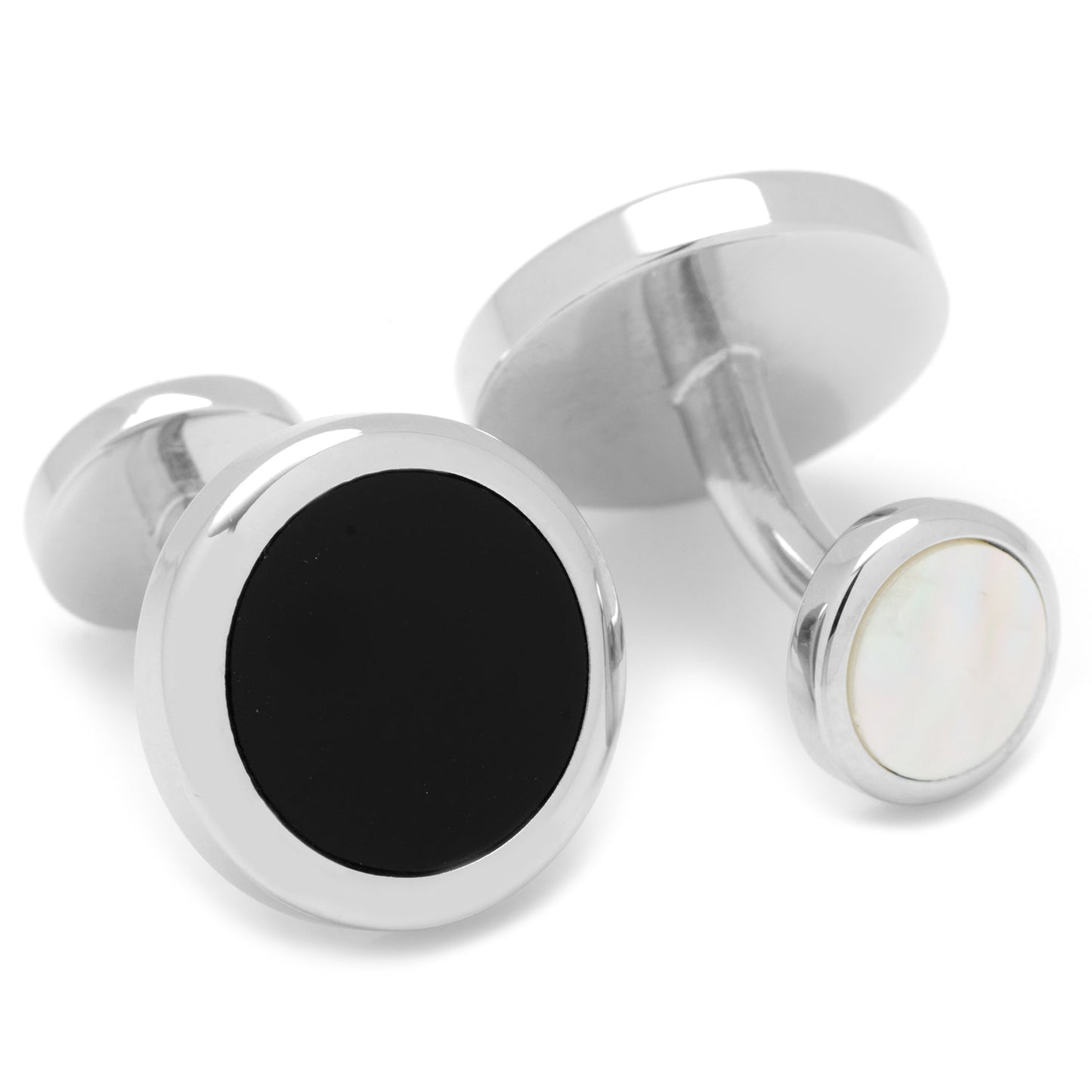 Silver cufflinks with black and white stones on a white background