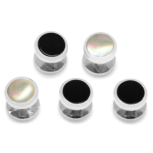 Set of six metallic ear gauges with black and pearl-like center stones on a white background