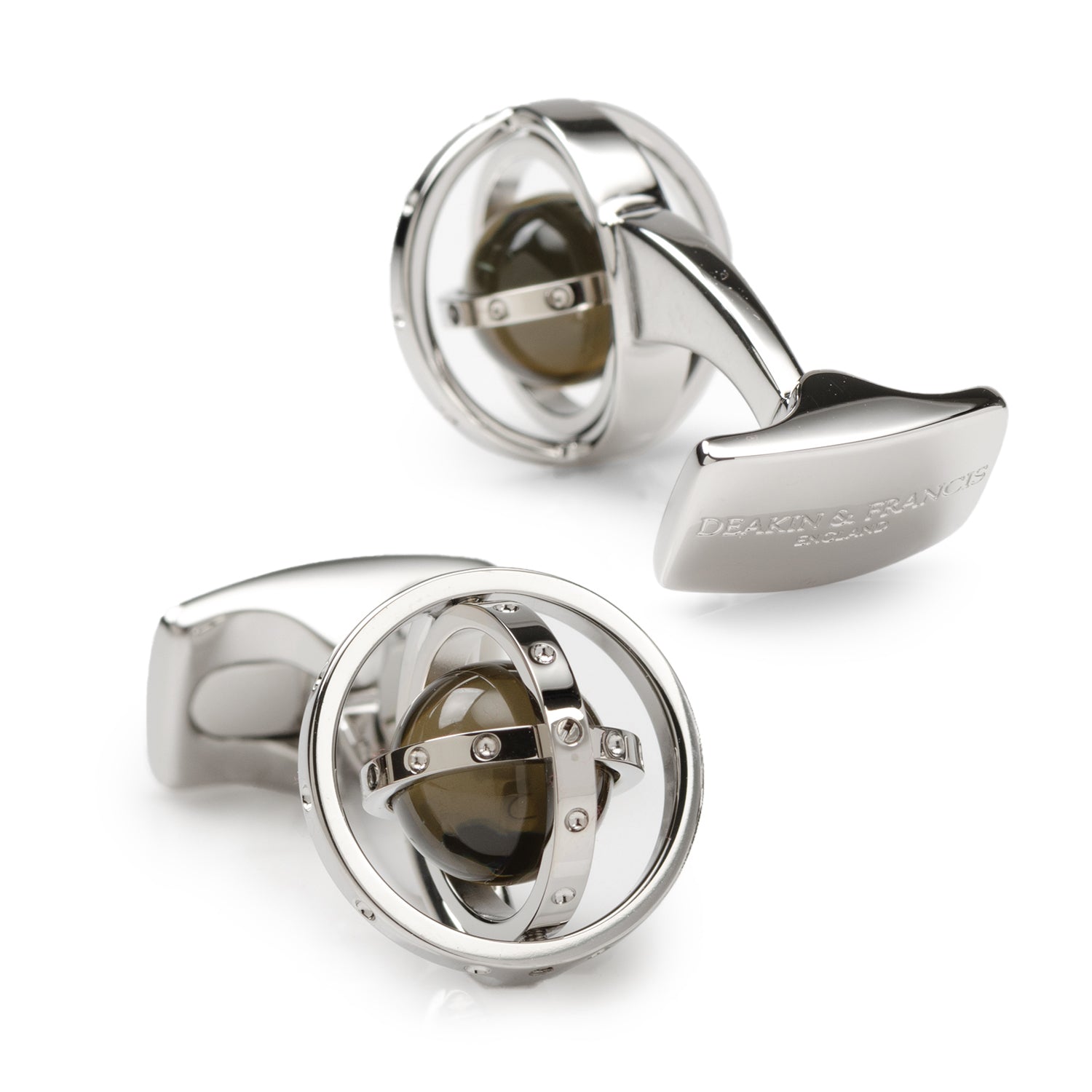 Silver cufflinks with a central gemstone on a white background