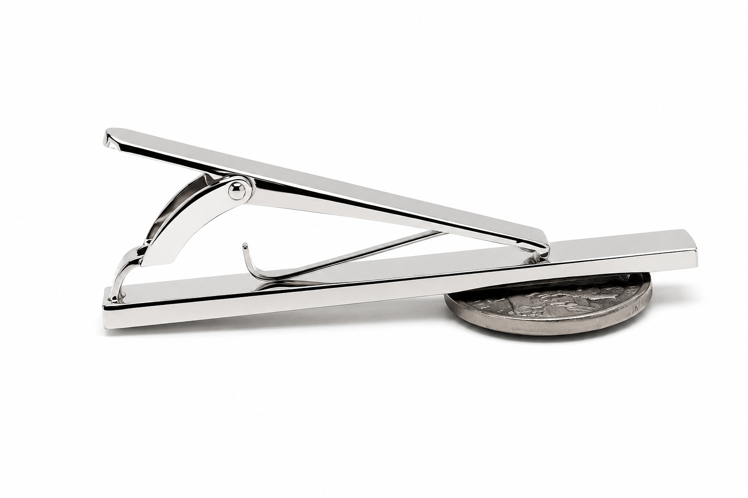 A polished silver tie bar clip shown on a clean white background, with a coin underneath to indicate scale.