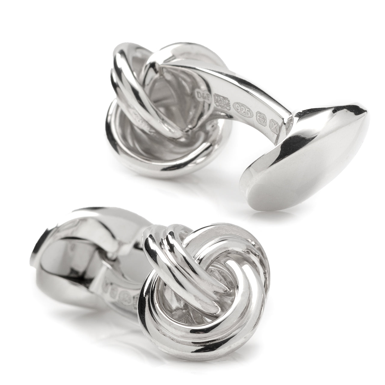 Silver knot cufflinks on a white background