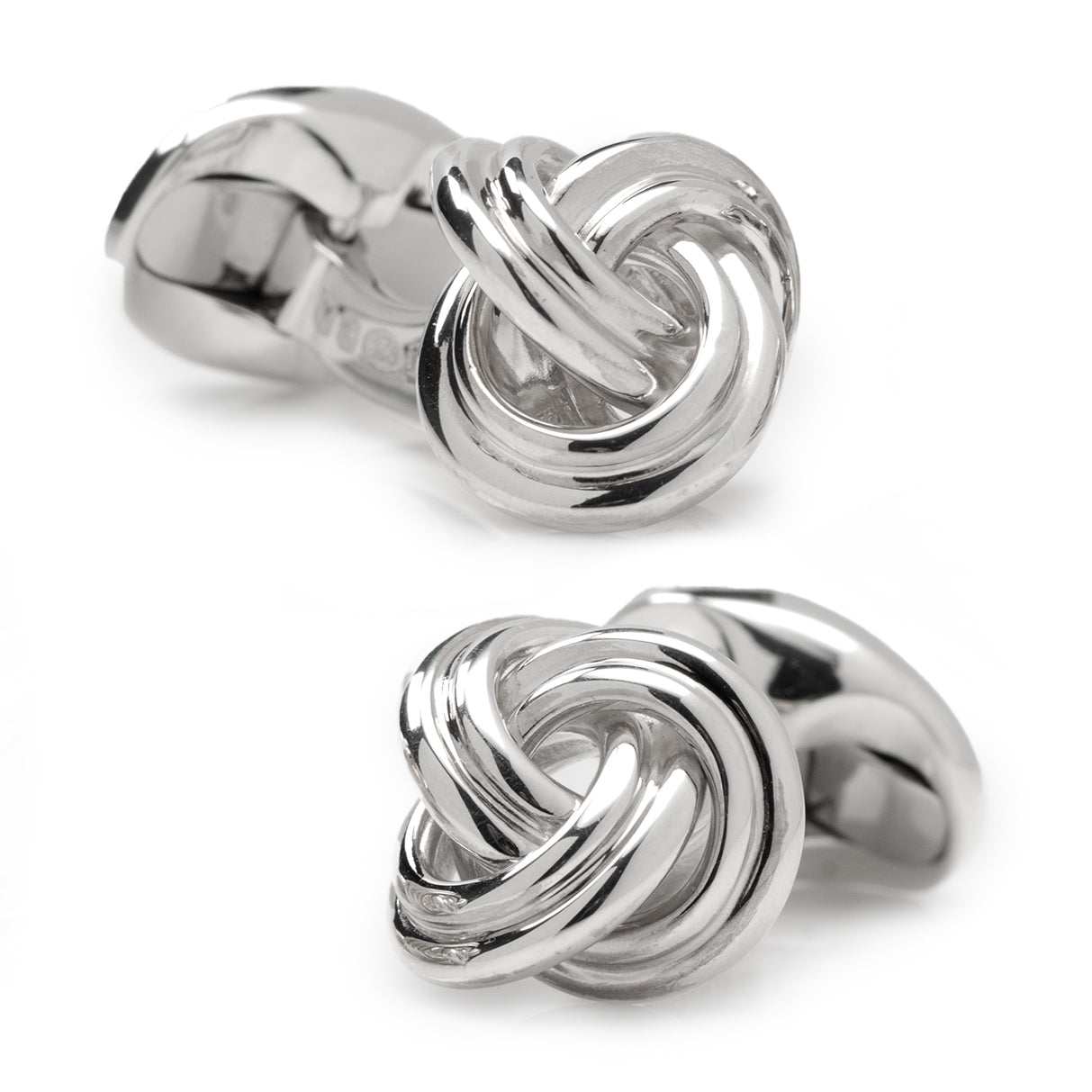 Silver knot-shaped cufflinks on a white background