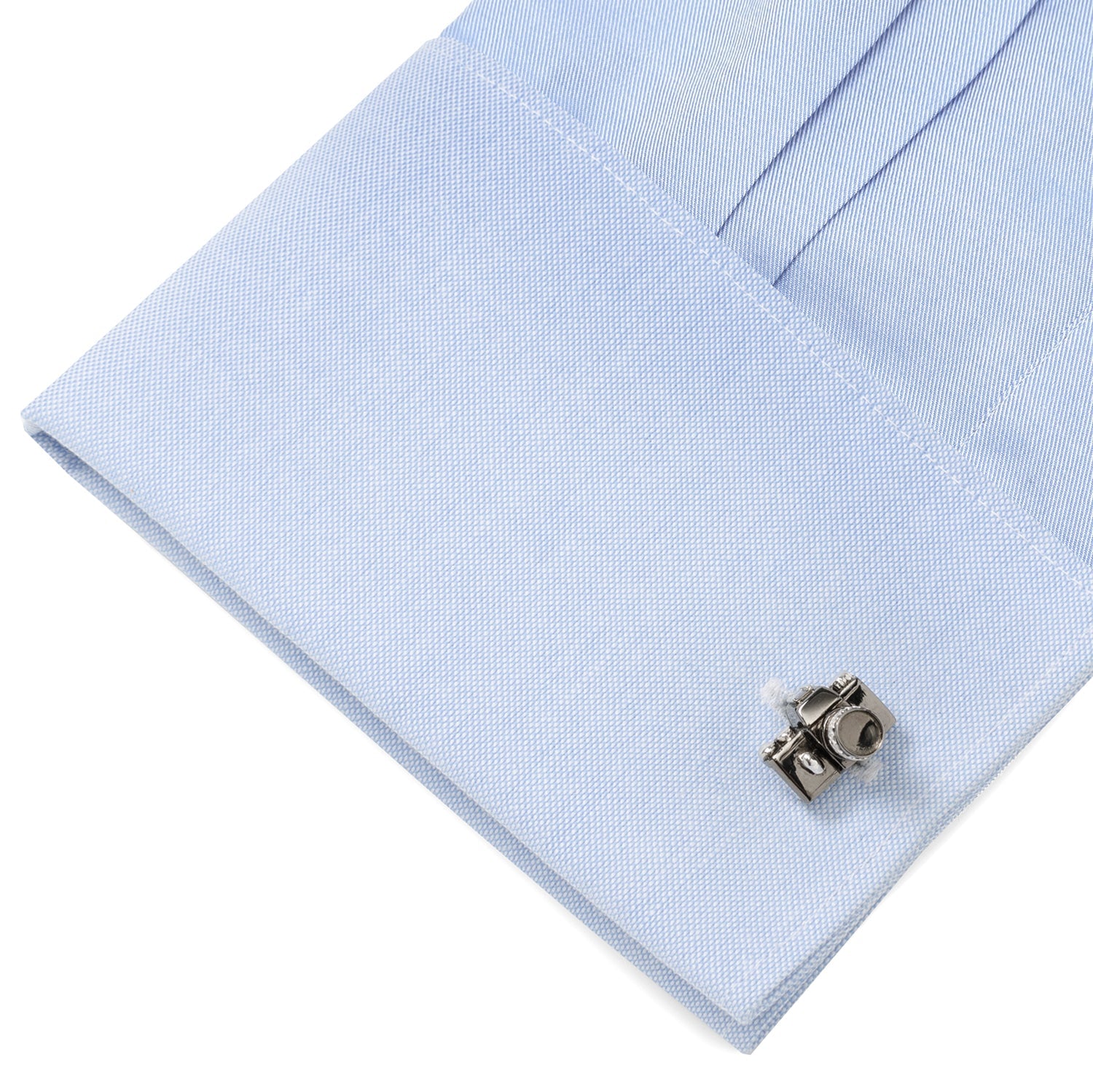 Cufflink on a light blue dress shirt