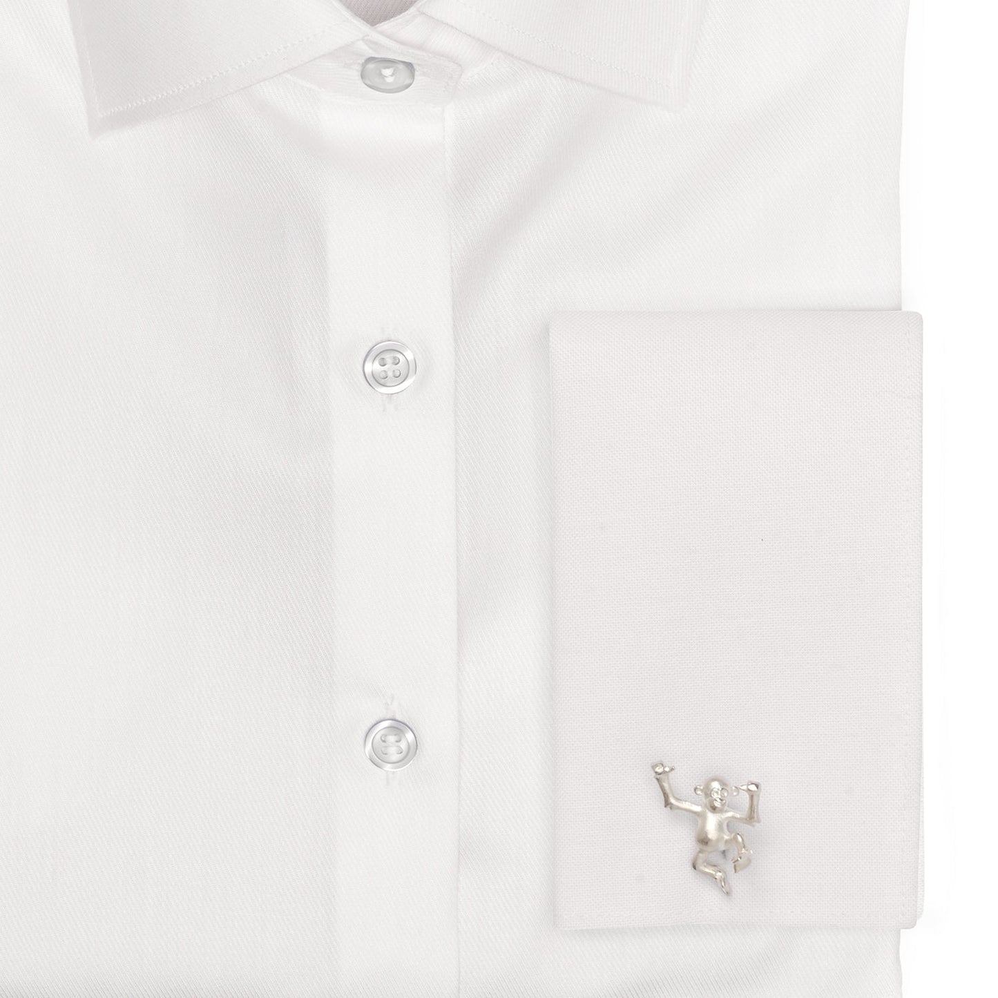 White shirt with a small decorative figure on a white background