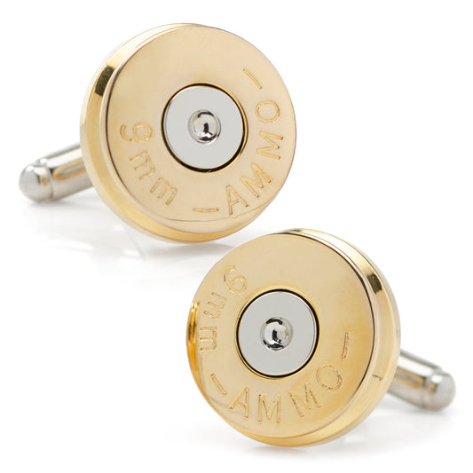 Gold and silver bullet-shaped cufflinks on a white background