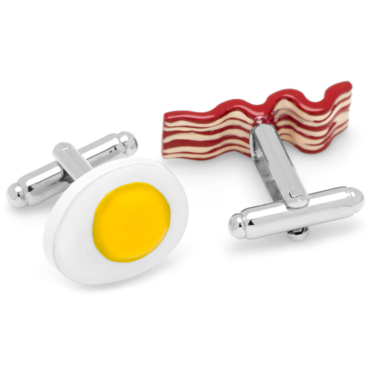 Cufflinks designed like a fried egg and wavy bacon on a white background