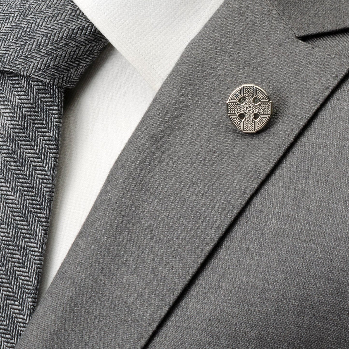 Gray suit jacket with a Celtic knot lapel pin, white shirt, and gray tie. Celtic Cross Lapel Pin