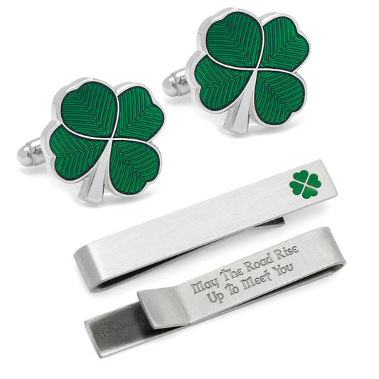 Set of shamrock cufflinks and tie bars on a white background