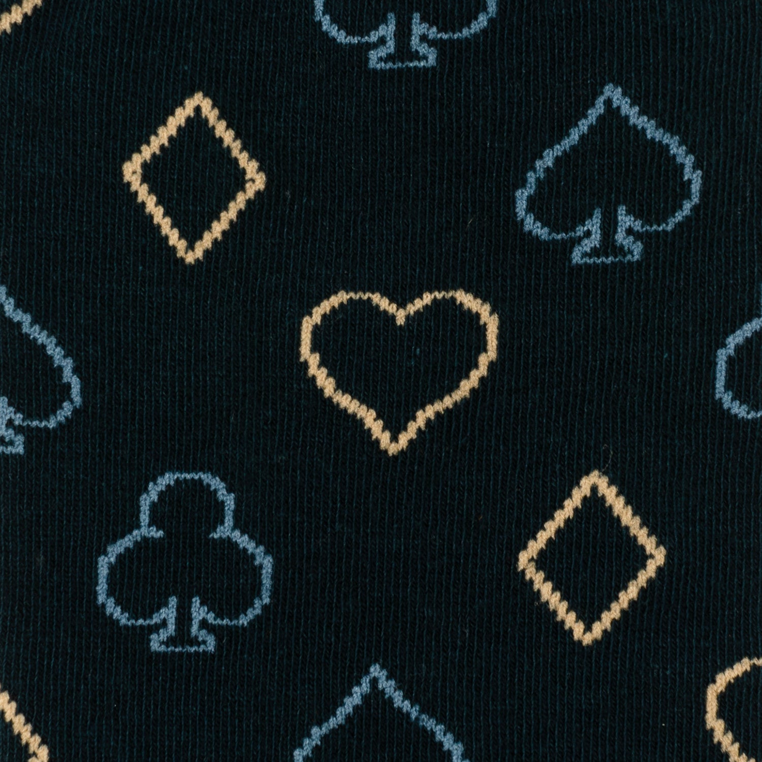 Pattern of card suits on a black background
