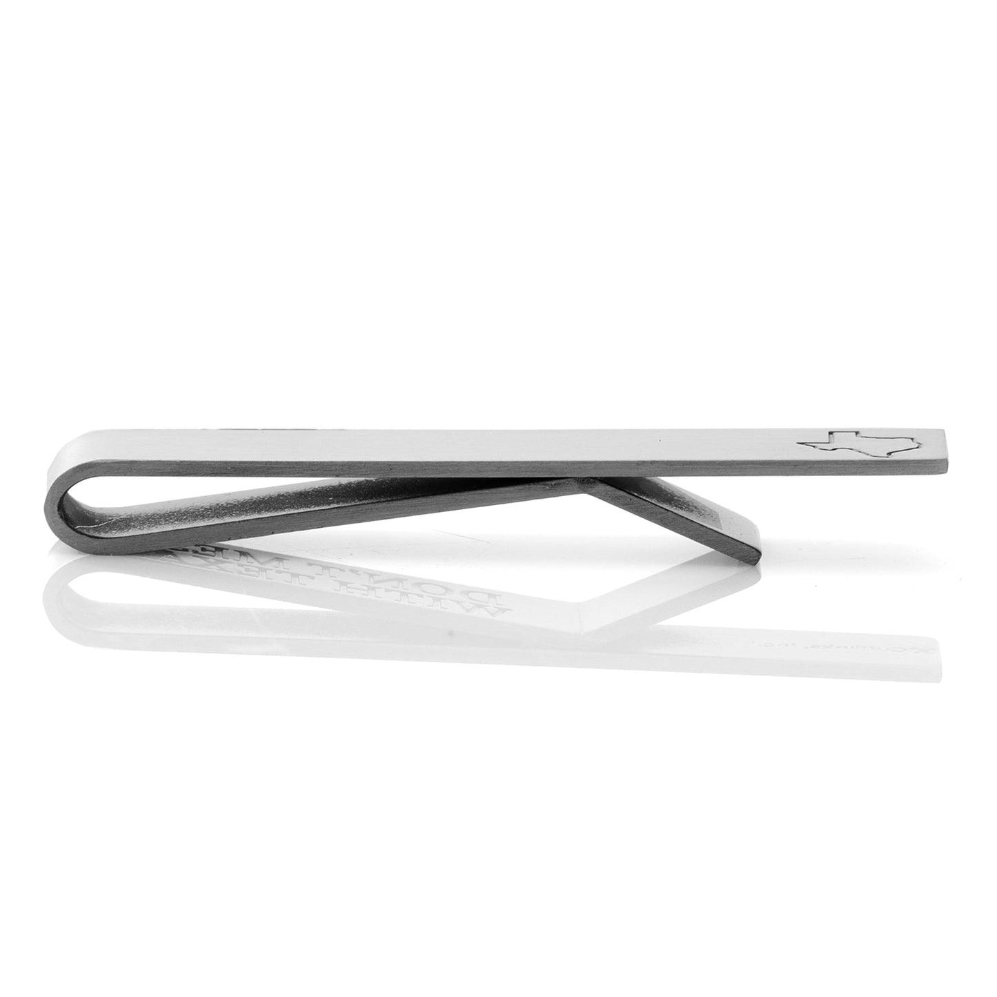 Metallic tie clip on a white background