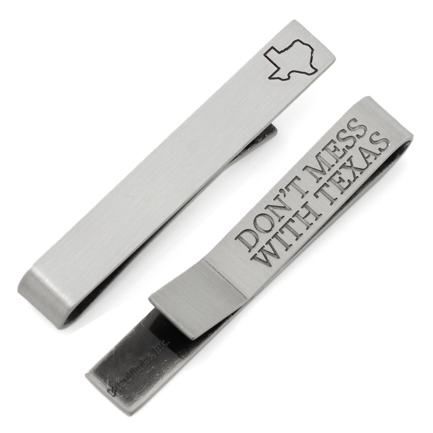 Silver tie clip and money clip with 'Don't Mess with Texas' text on a white background