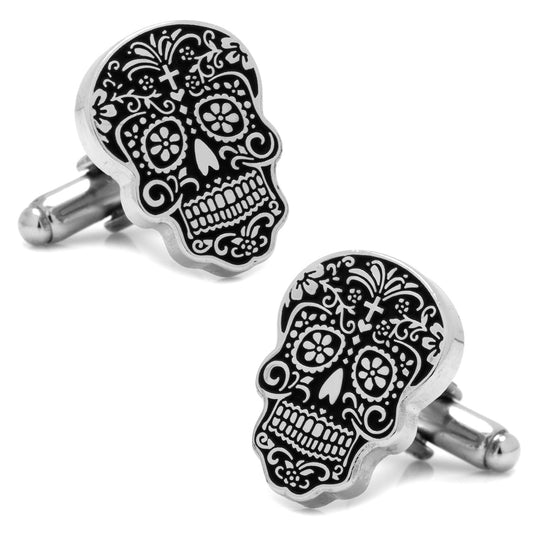 Black skull design cufflinks on a white background