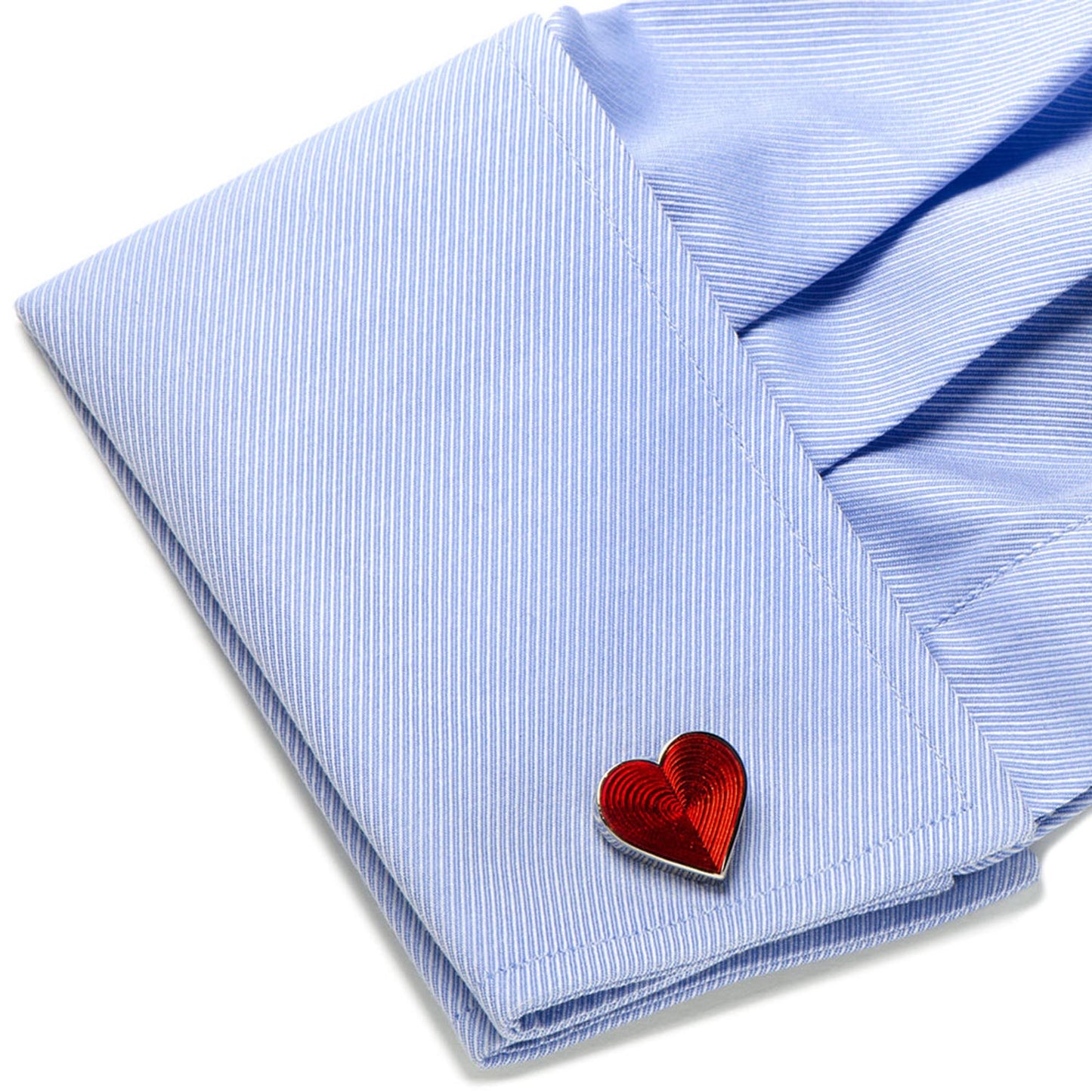 Red heart-shaped lapel pin on a light blue striped shirt