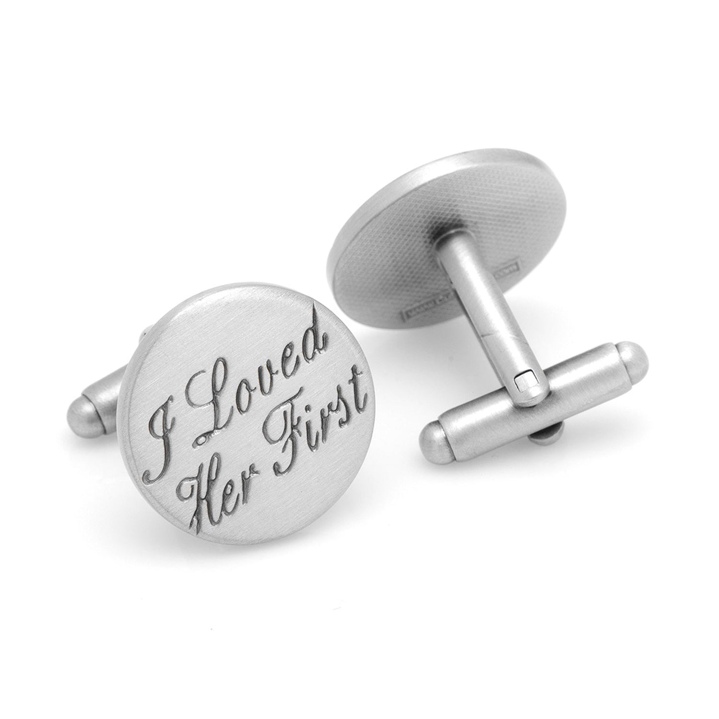 Silver cufflinks with engraved text on a white background