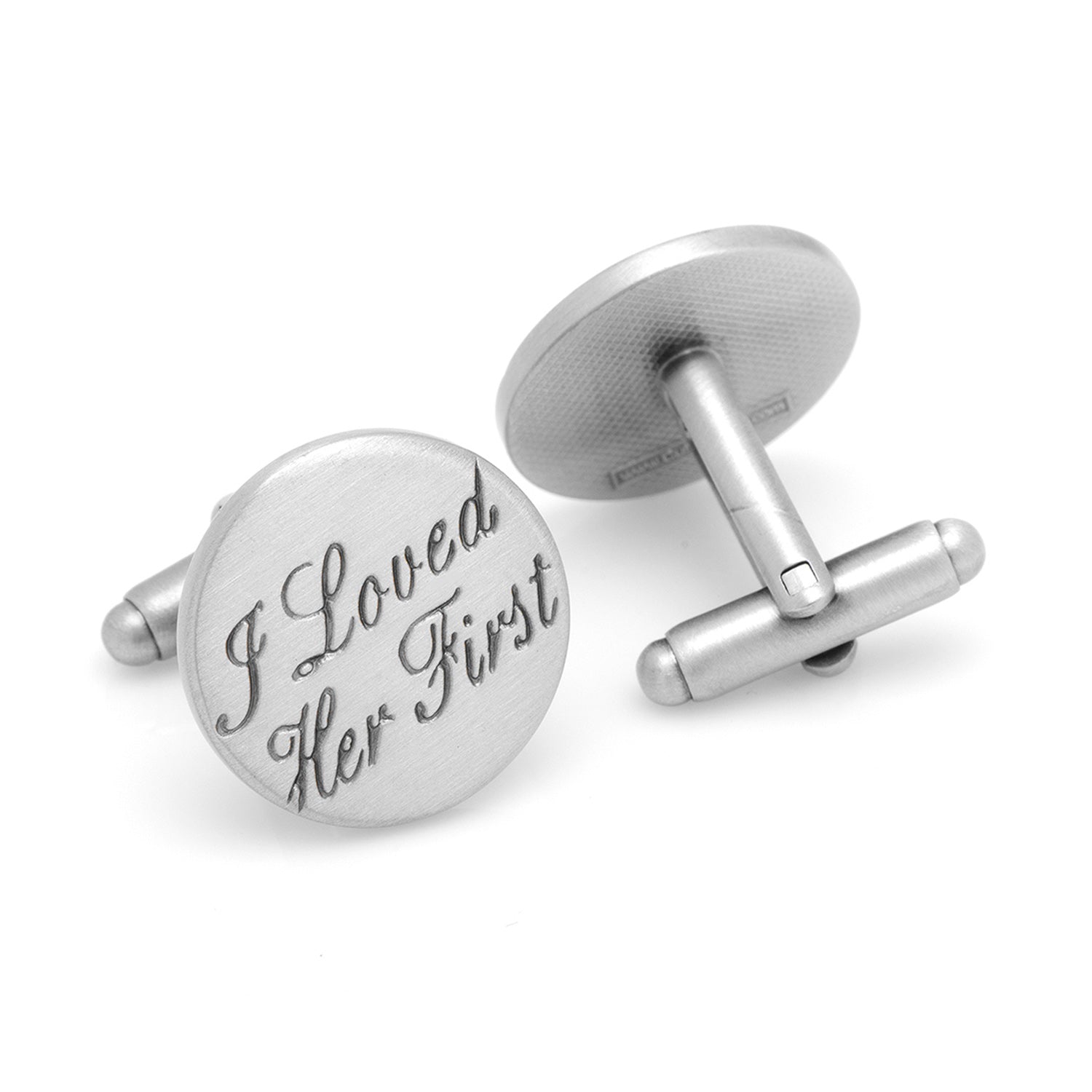Silver cufflinks with engraved text on a white background