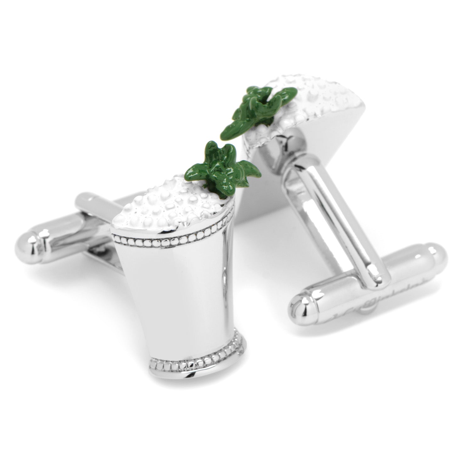 Cufflinks designed like a cocktail glass with a green leaf on a white background