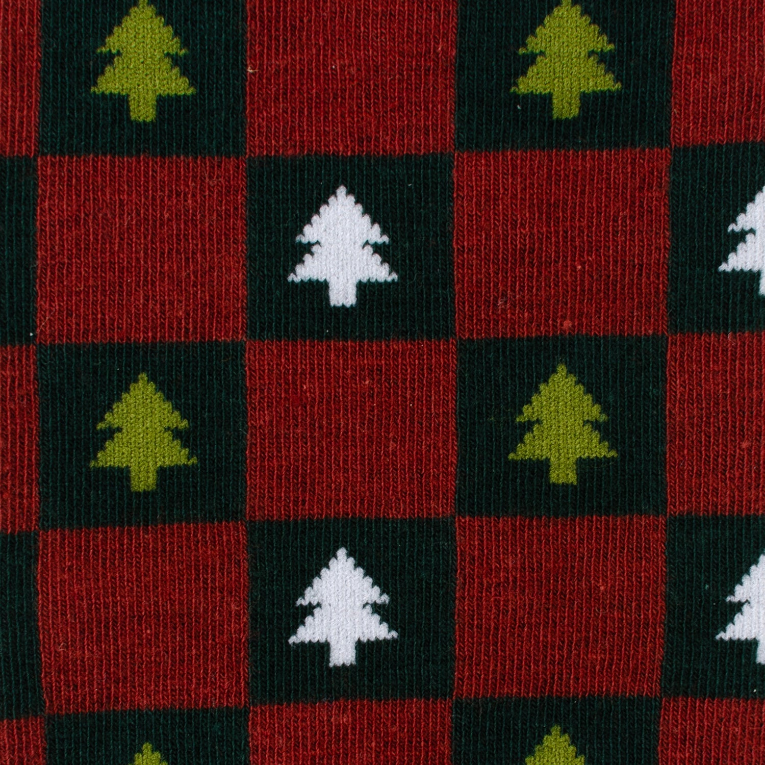 Checkered fabric with Christmas tree patterns on a red, green, and black background