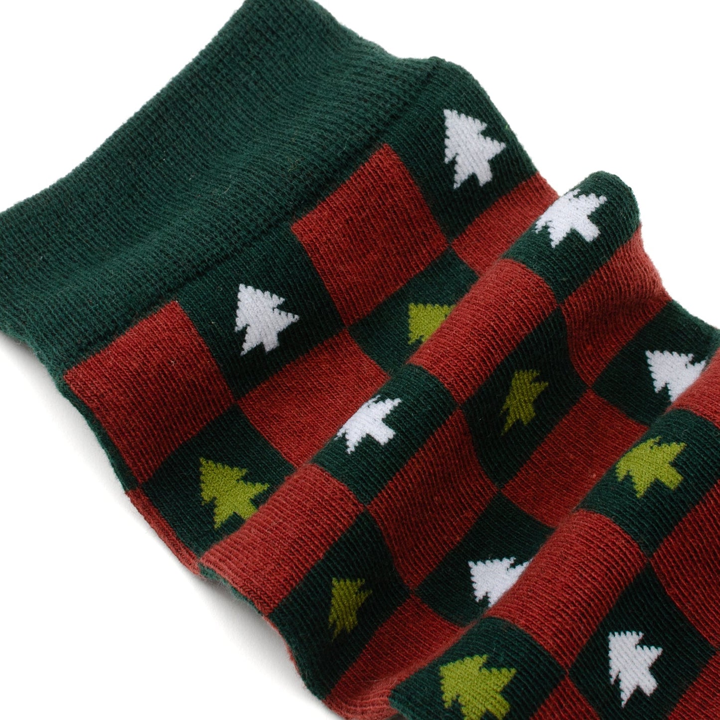 Pair of socks with a checkered pattern featuring trees on a white background