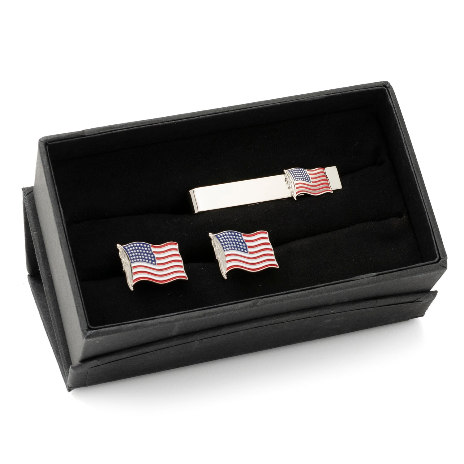Set of American flag cufflinks and tie clip in a black display box.