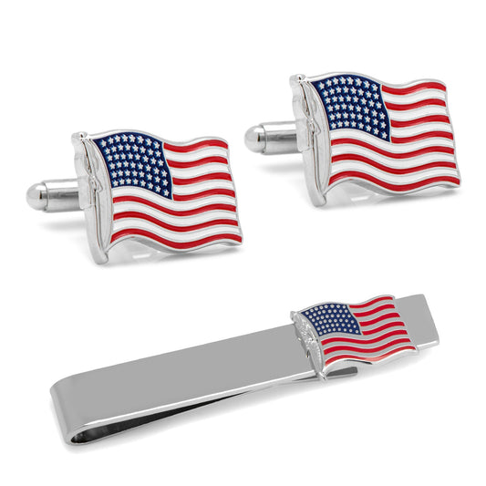 Set of American flag cufflinks and a tie clip on a white background