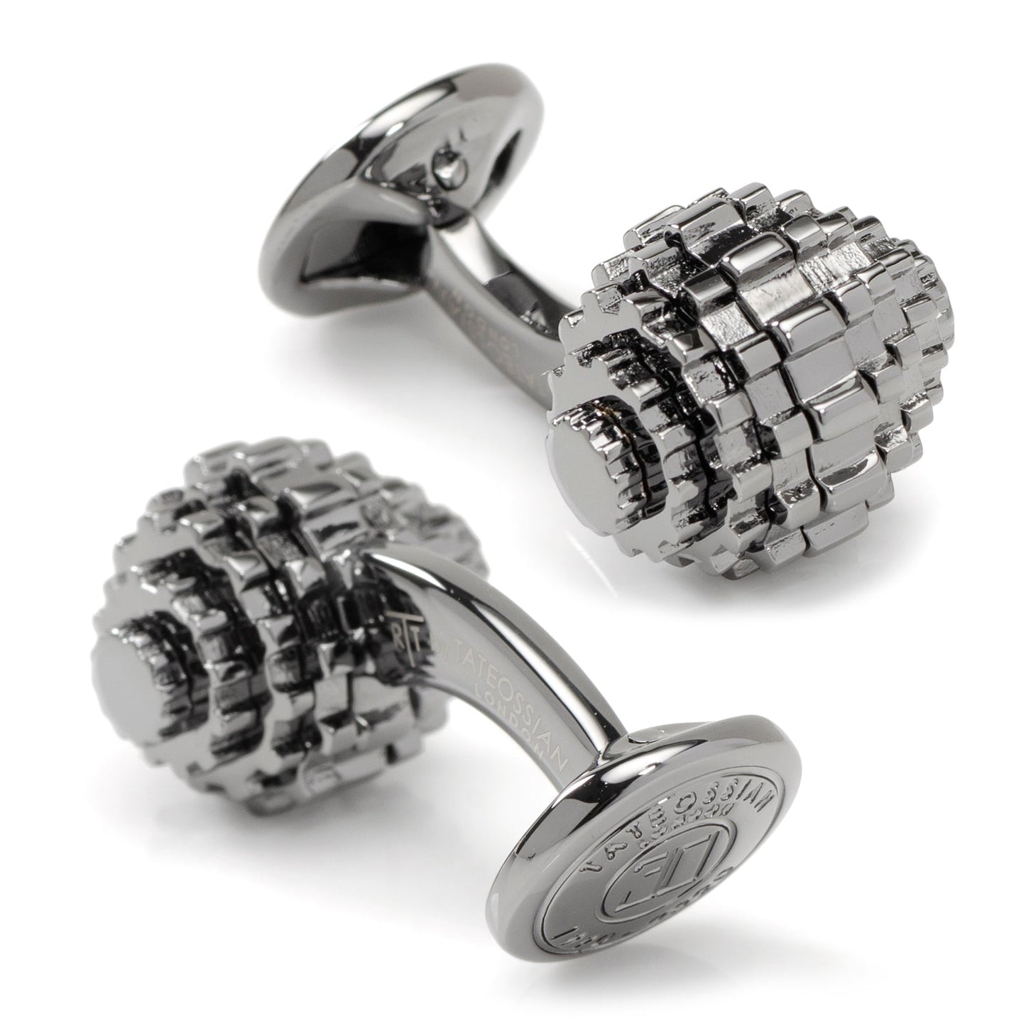 Silver cufflinks with textured design on a white background