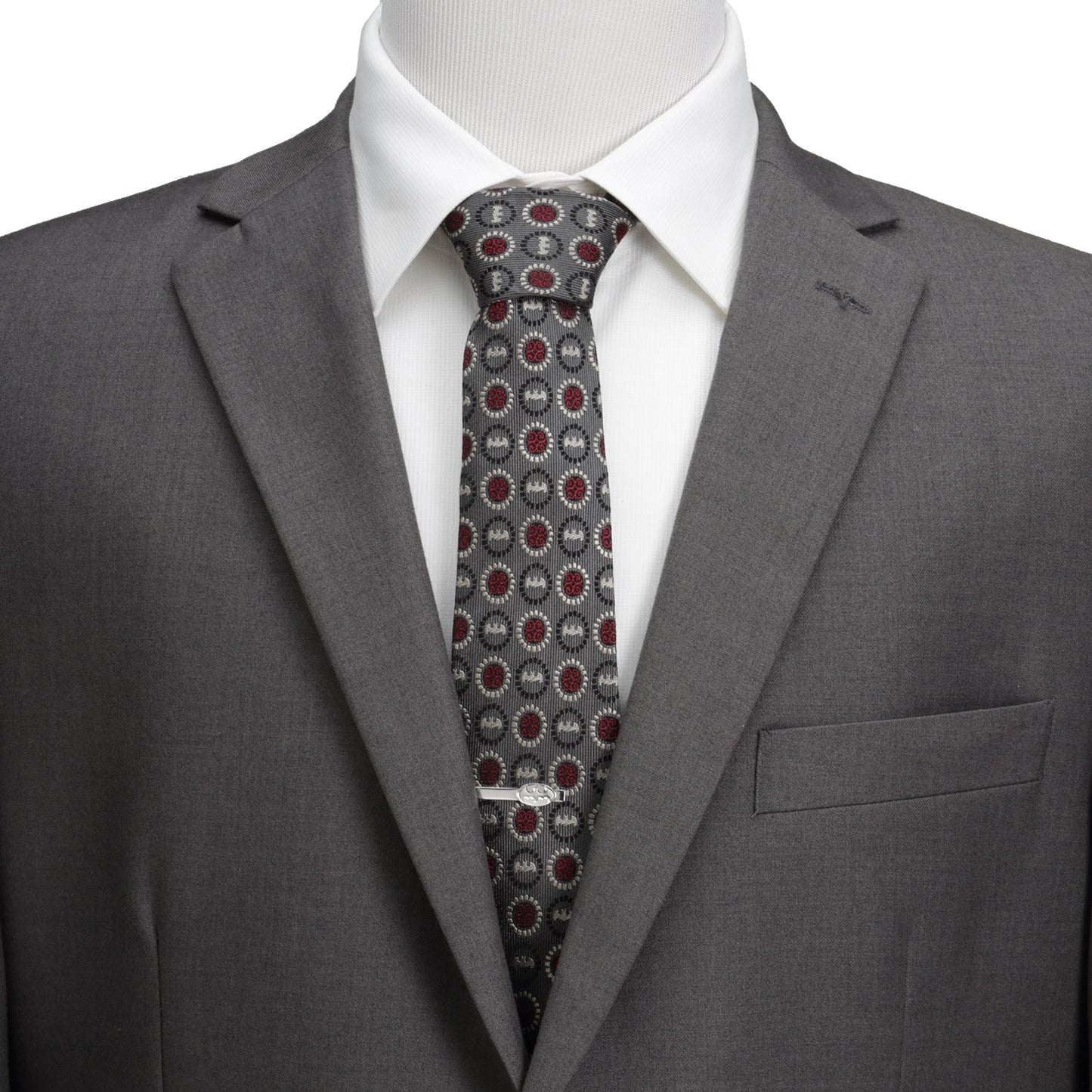 Gray suit with a patterned tie on a mannequin against a white background