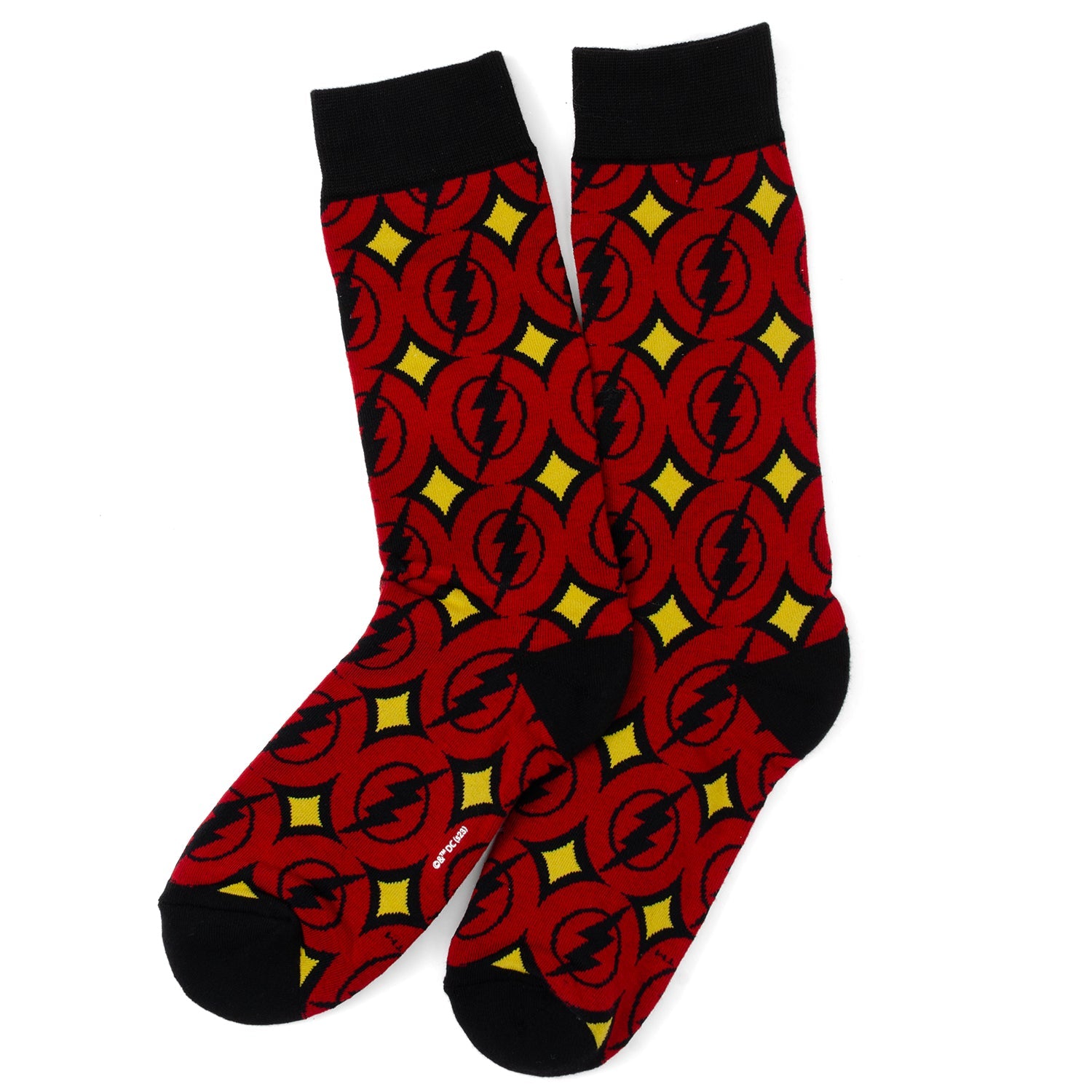 Red socks with black and yellow pattern on a white background
