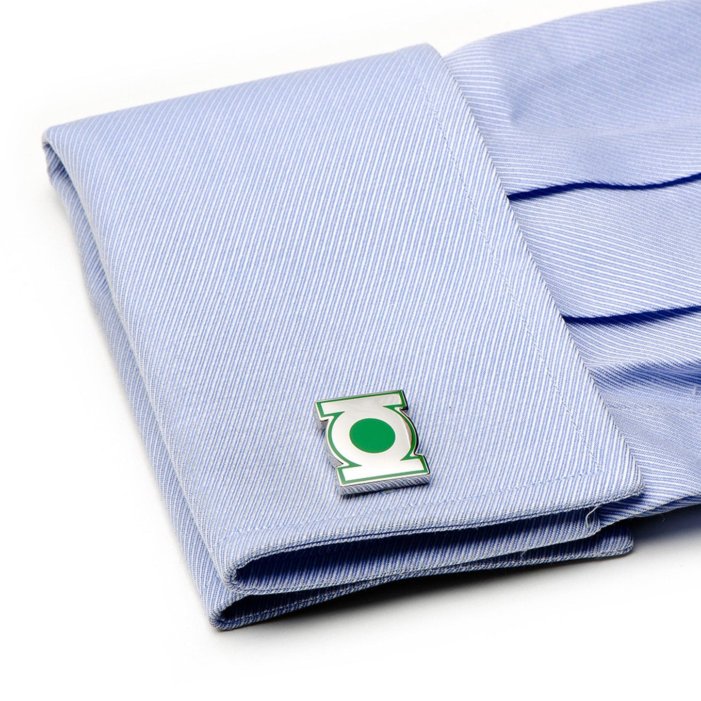 Folded blue striped shirt with a green emblem on a white background
