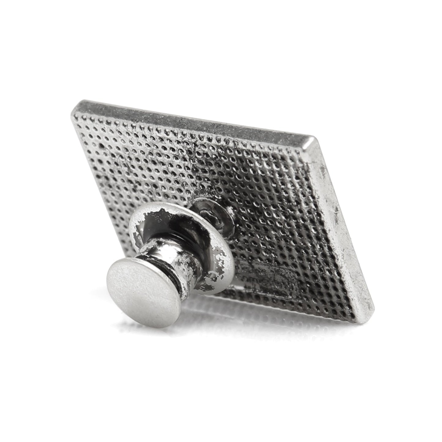 Metallic square pin with textured surface on a white background