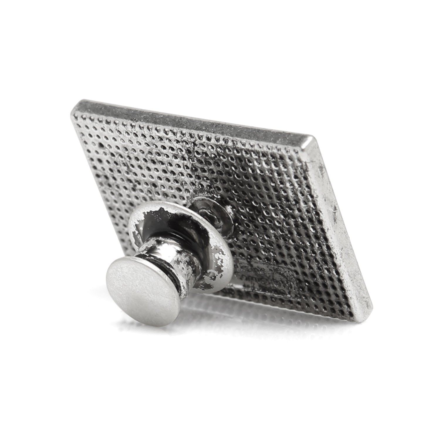 Metallic square pin with textured surface on a white background