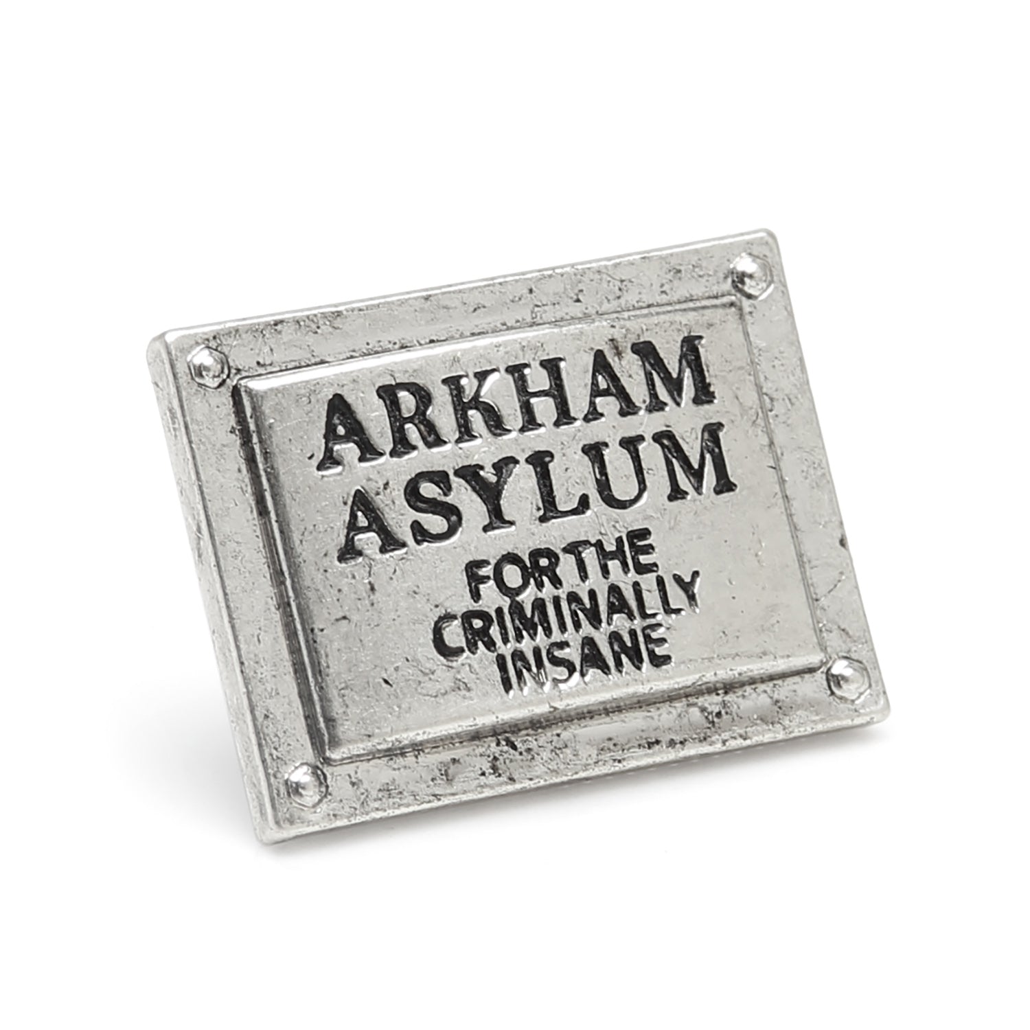 Metal sign with 'Arkham Asylum' text on a white background