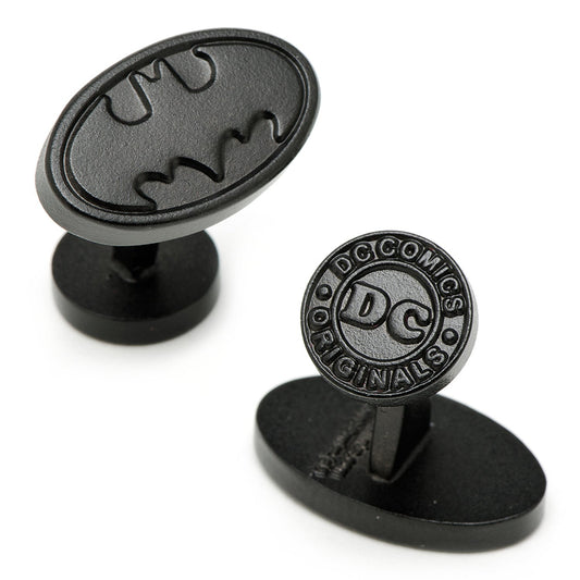 Black cufflinks with Batman logo and DC Comics branding on a white background